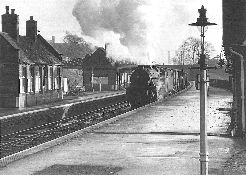 Ex-LMS Class 5 No 44812 is seen at the head of a mixed freight coming off the Camp Hill line, one winters day