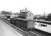 An unidentified ex-MR 0-6-0 3F locomotive hauls a pair of ex-GWR 'Toad' brake vans on the down West Suburban line
