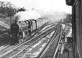 Ex-LMS 4-6-0 'Class 5' No 44945 is seen travelling at speed on a Derby to Bristol express passenger train on 7th March 1954