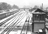 View of Kings Norton signal box with the snow having been cleared from the point rodding under the tracks