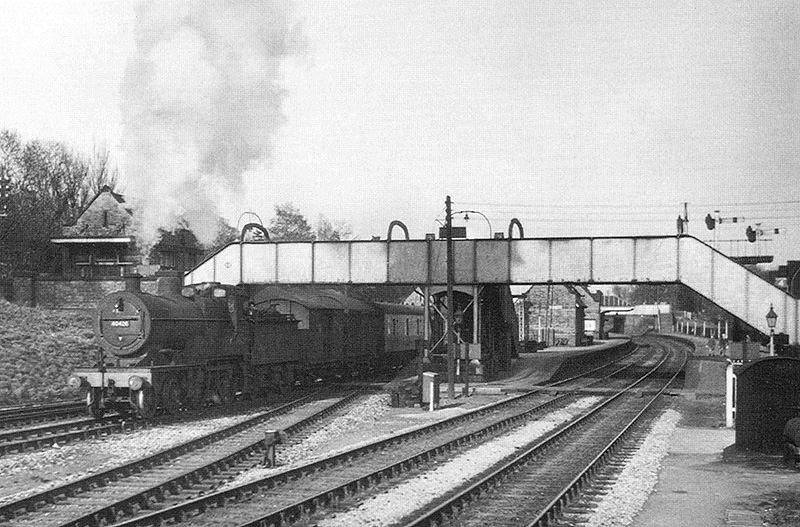 Ex-MR 4-4-0 2P No 40426 is on a return working to its home shed of Bristol as it heads a down ordinary local passenger service