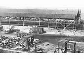 Another view of Lawley Street Goods Depot being rebuilt during World War II with a variety of road vehicles on display