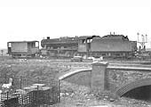 Ex-LMS 2-8-0 8F No 48538 is coupled to goods brake van D1659 allocated for departmental use on 21st November 1964