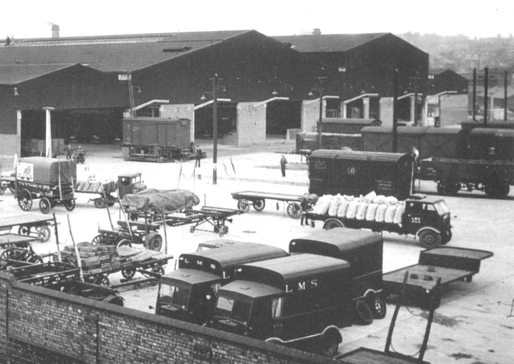 Close up showing the traverser moving a covered van across the front of the Lawley Street Depot's shed