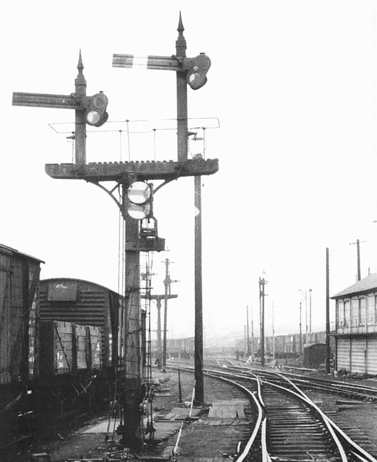View of the front of one of Lawley Street's bracket signals fitted with LMS disc signals fitted to the post