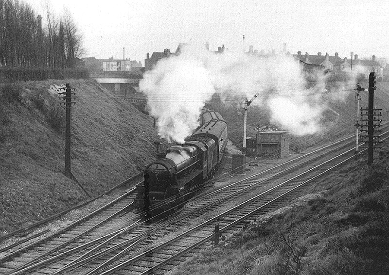An unidentified ex-LMS 4-6-0 'Black 5' is seen coming off Lifford West Junction with empty stock from New Street station on 16th April 1955
