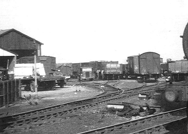 Close up showing Lifford goods yard's replacement shed on the left and an assortment of open and covered goods wagons