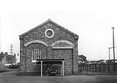 End view of Lifford Station Junction goods shed showing the bricked-up rail entrance and cycle shed