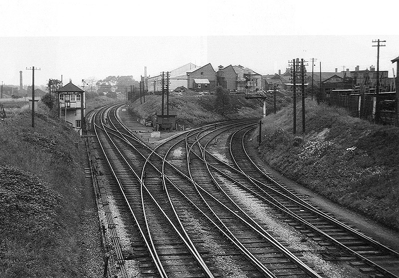 Looking towards Kings Norton with Lifford Station signal box on the left and Lifford Curve on the right on 29th July 1957