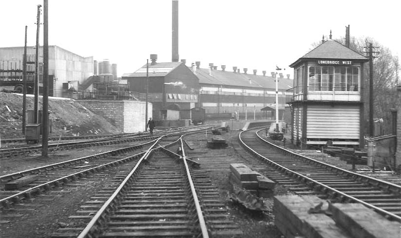 Longbridge West Signal Box on the right with the station in the distance on 12th March 1962
