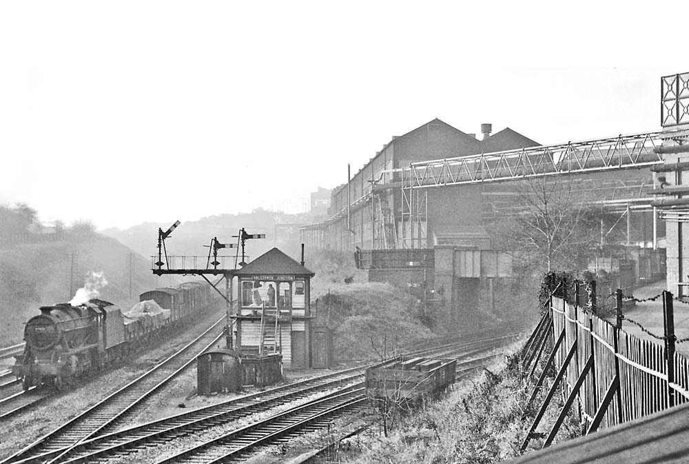 Ex-LMS 8F 2-8-0 No 48424 passes Halesowen Junction Signal Box at Longbridge on 4th December 1964