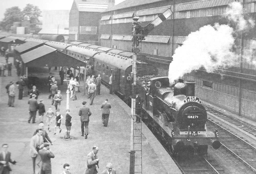 Ex-Midland Railway 2F 0-6-0 No 58271 stands at Longbridge station with an SLS Railtour on Saturday 30th May 1959