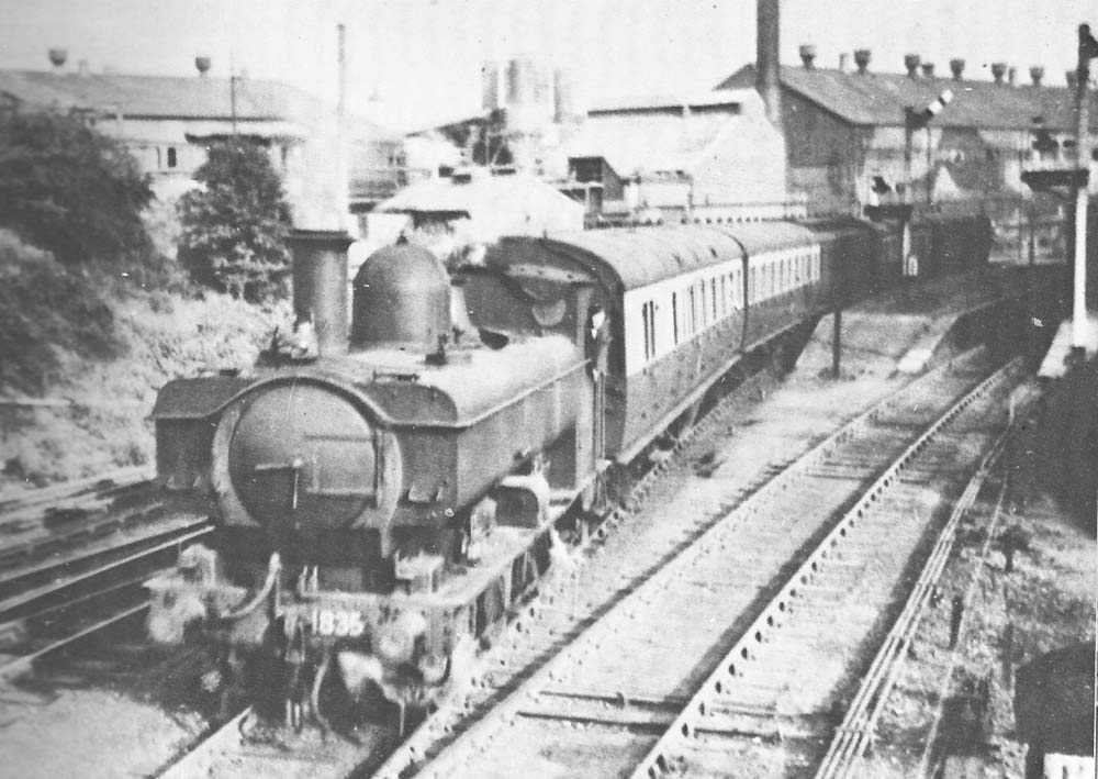 GWR 0-6-0PT  No 1835 is seen leaving Longbridge station with a GWR Workman�s train for Old Hill circa 1946