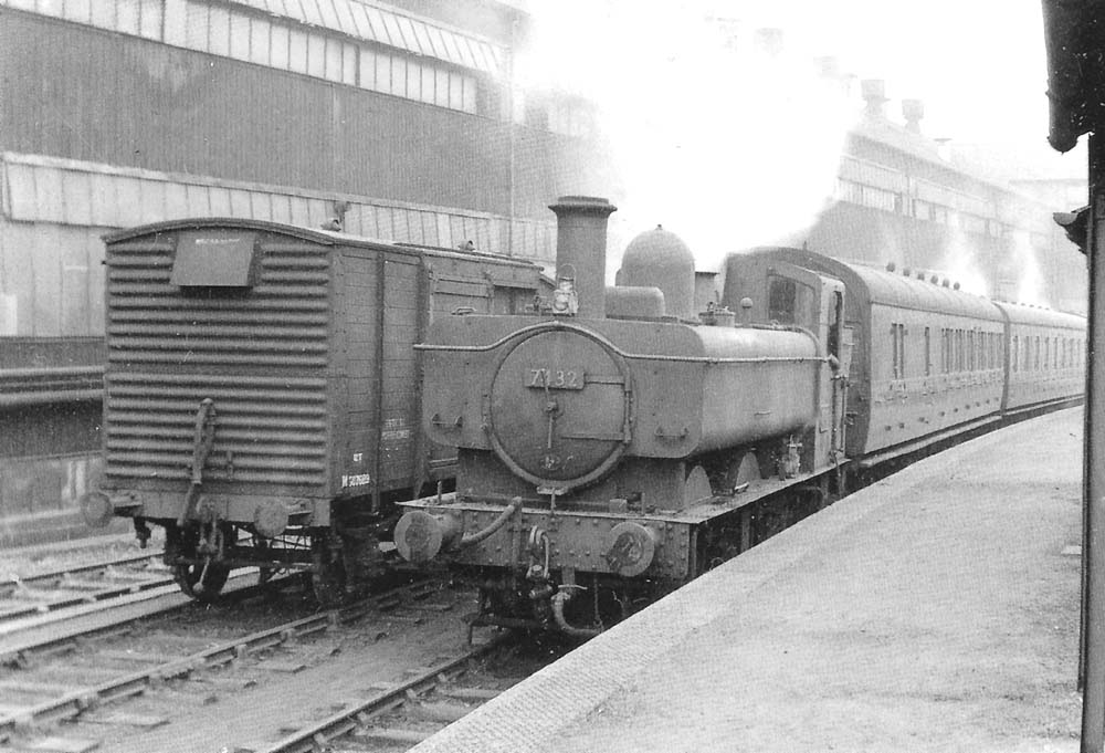 British Railways 0-6-0PT 64xx class No 7432 leaves Longbridge station with the 5:09pm Workman's train for Old Hill on Monday 8th April 1957