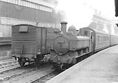 BR 0-6-0PT No 7432 leaves Longbridge station with the 5:09pm Workman's train for Old Hill on Monday 8th April 1957