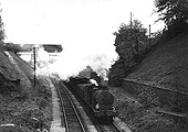 Ex-LMS 0-6-0 4F No 44150 passes the now closed Moseley station as it passes under Woodbridge Rd bridge