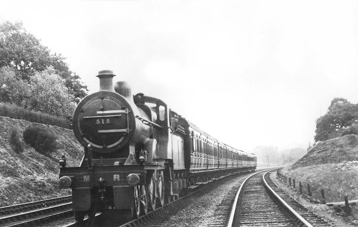 Midland Railway 4-4-0 2P No 515 passes by on an down express train train on 1st August 1921