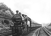 Midland Railway 4-4-0 2P No 515 passes by on an down express train train on 1st August 1921
