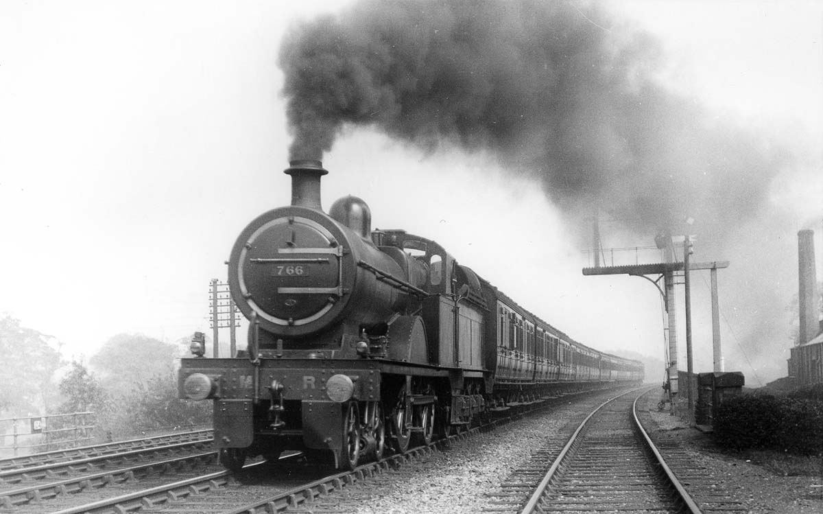 MR 4-4-0 No 766 is seen working hard with black smoke pouring from its chimney as heads an express passenger service in August 192