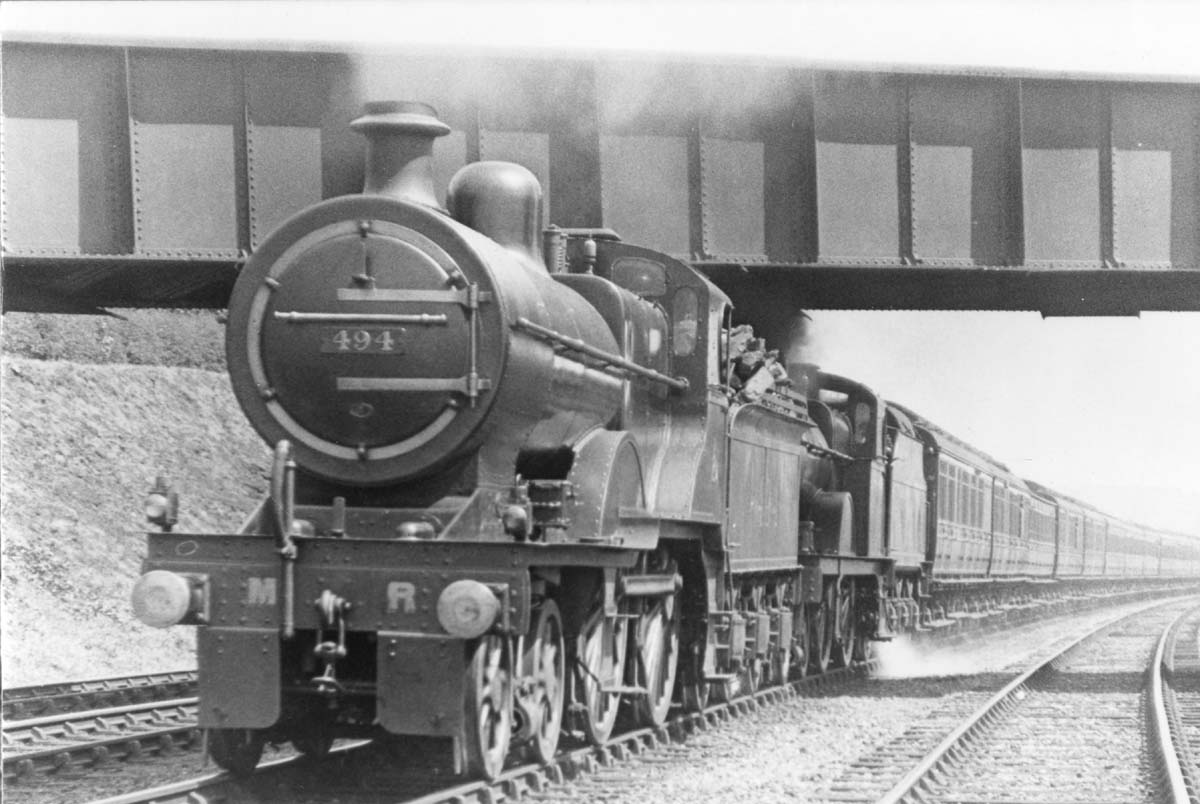 MR 2P 4-4-0 No 494 and MR 4-4-0 No 688 are making light work of working an express passenger service near Northfield on 6th August 1921