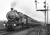 MR 2P 4-4-0 No 505 passes Midland Railway bracket signals whilst at the head of a seven coach express train