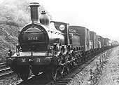 MR outside curved framed 0-6-0 1F No 2702 is seen on a goods train near Northfield on 1st August 1921