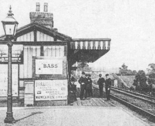 Close up showing the modesty screen to the Gentlemen's toilet and one of station's gas lampposts