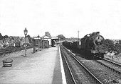 Ex-LMS 0-6-0 4F No 44179 is seen passing on the down goods line at the head of a Class H freight train