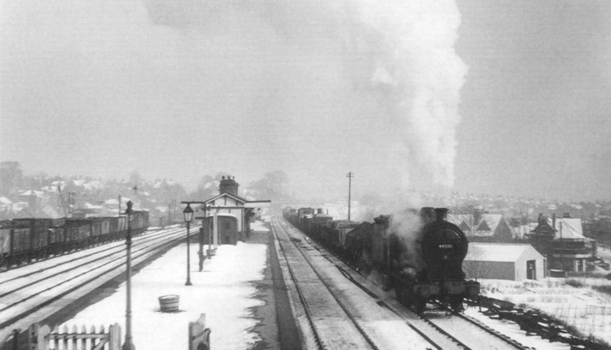 Ex-LMS 0-6-0 4F No 44590 is seen passing snow covered Northfield on a down Class J mineral train on 27th February 1955