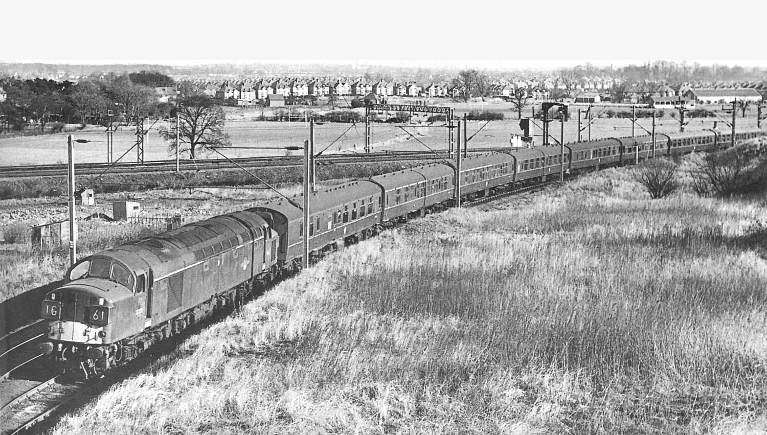 Diesel locomotive D331 is seen leaving the West Coast Main Line at the head of a diverted Euston to Birmingham service