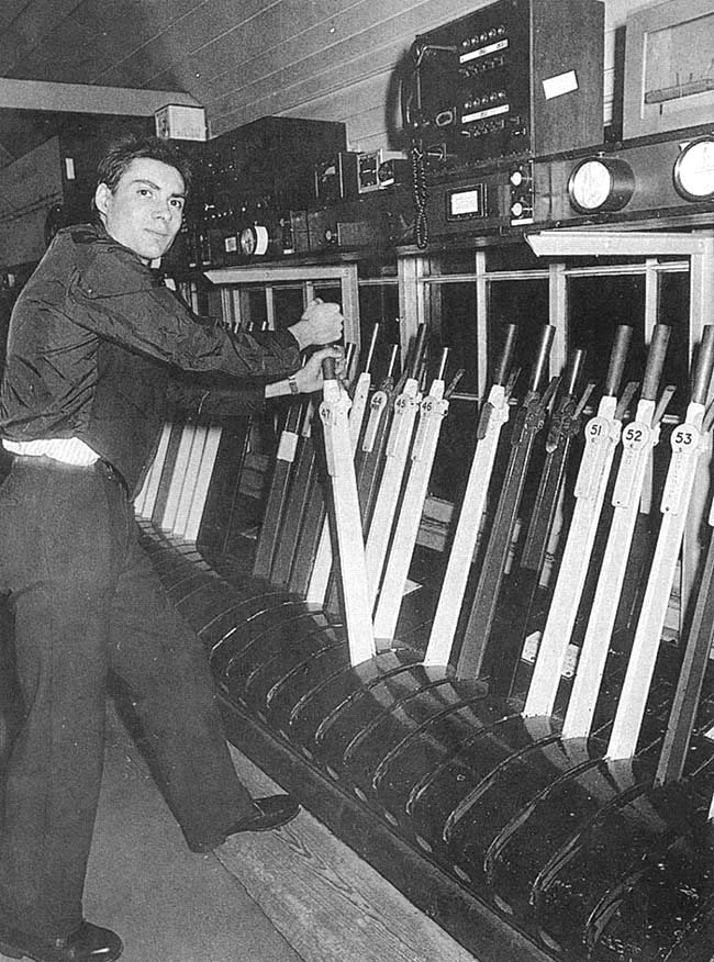 Shaun Jasper, Relief Signalman, is seen working inside Abbey Junction signal box during one of the last shifts prior to its closure in February 1992