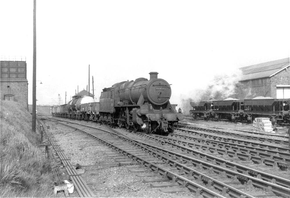 Ex-LMS' 5MT 2-6-0 No 42951, a 'Stanier Crab' is coming up from the Trent Valley line with a mixed freight