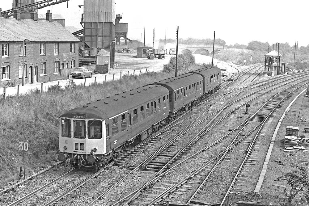 A Diesel Multiple Unit, forming the 10:15 Birmingham to Norwich service approaches Nuneaton Abbey Junction to enter the Ashby line in the early 1960s