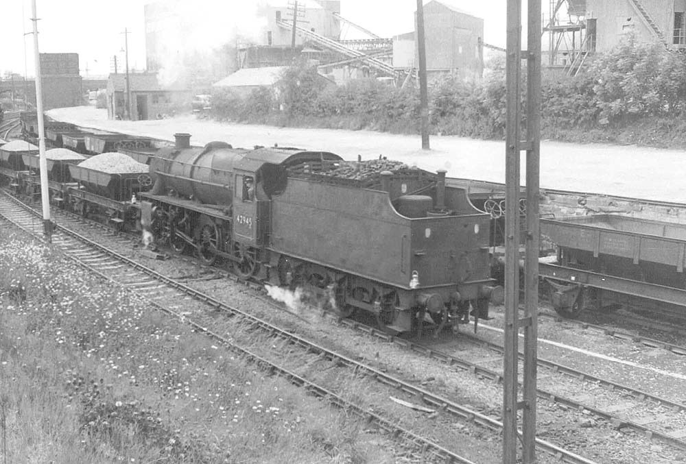 Ex-LMS 5MT 2-6-0 No 42945 carries out shunting duties with filled stone wagons from the adjacent Judkins stone wharf sidings