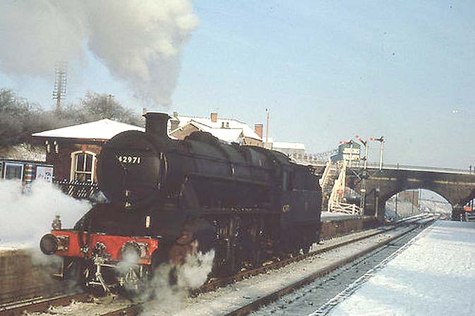 Ex-LMS 5MT 2-6-0 No 42971 runs tender first and 'light engine' through Abbey Street  towards Leicester