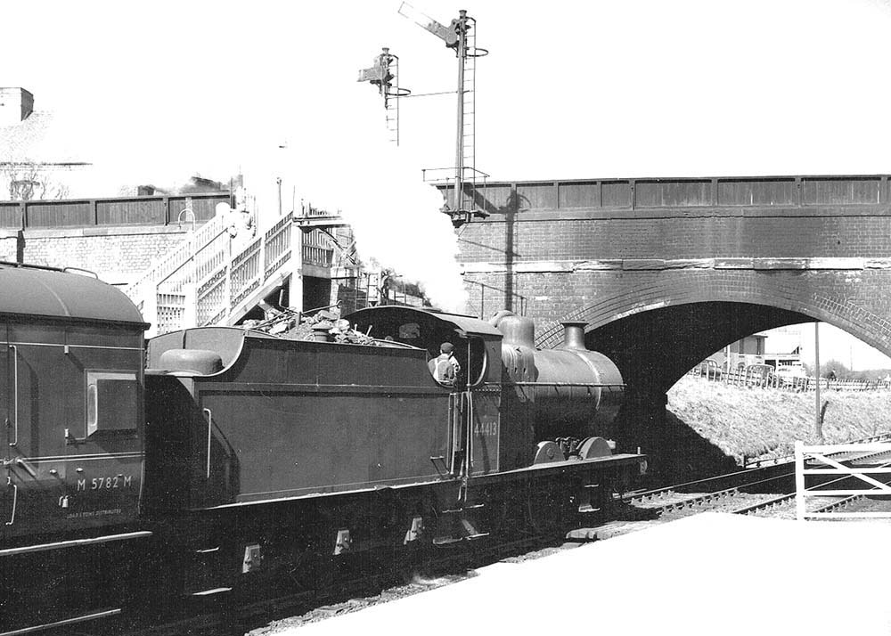 Ex-LMS 4F 0-6-0 No 44413, with steam lifting from the valves, is about to leave the station with a New Street service for Leicester