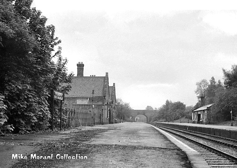 Looking along the down platform from the Walsall end of Penns station with the main building on the left