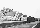 Looking to Water Orton from the down platform as a local passenger service arrives at Penns station circa 1930s