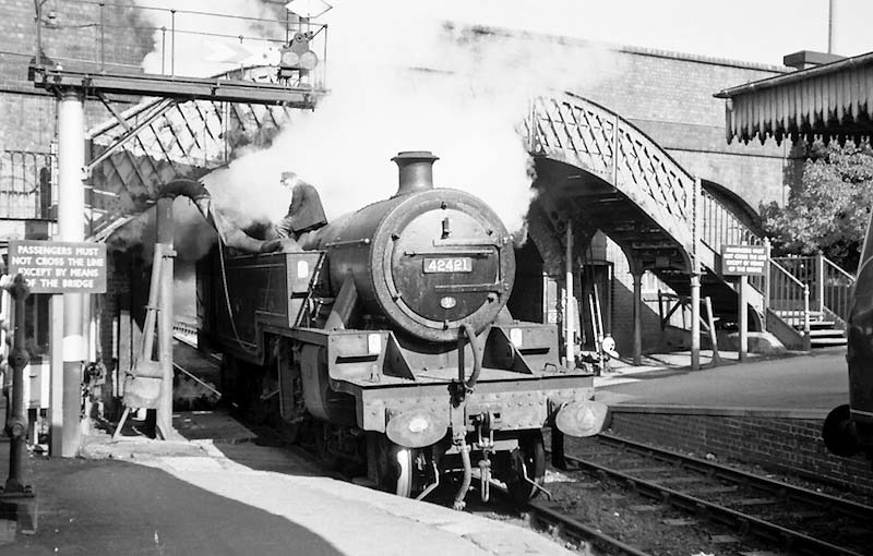 Ex-LMS 2-6-4T 4P No 42421 is seen taking water at the north end of Redditch station on 27th September 1962