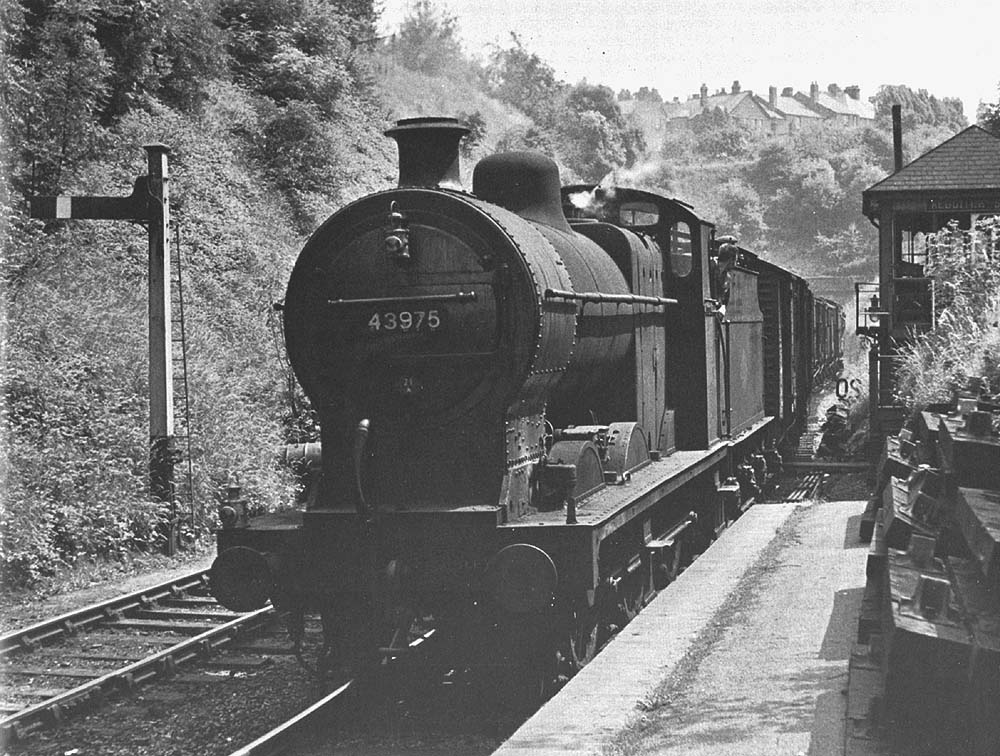 Ex-LMS 0-6-0 4F No 43975 enters the confines of Redditch station on a partly fitted freight service from Evesham in June 1960