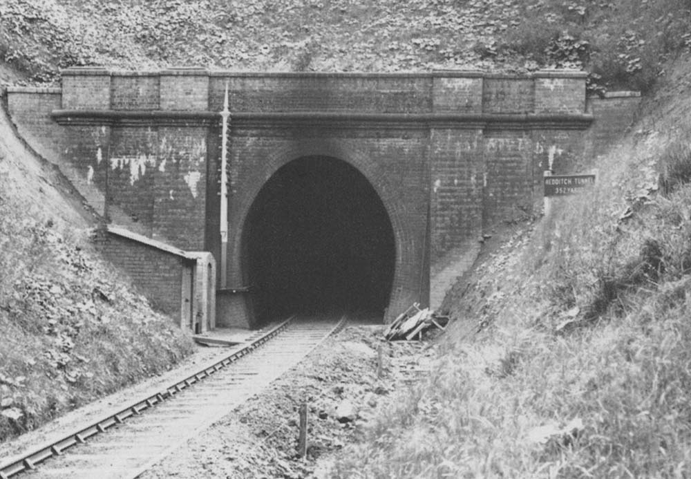 An undated view of the north portal of Redditch tunnel with the tunnel's nameboard on the right