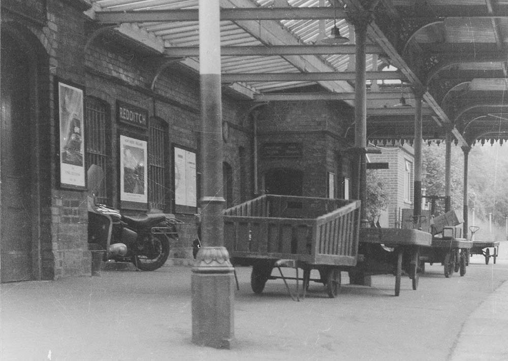 Close up showing a variety of parcel carts and trucks used to move parcels and other loads at the station