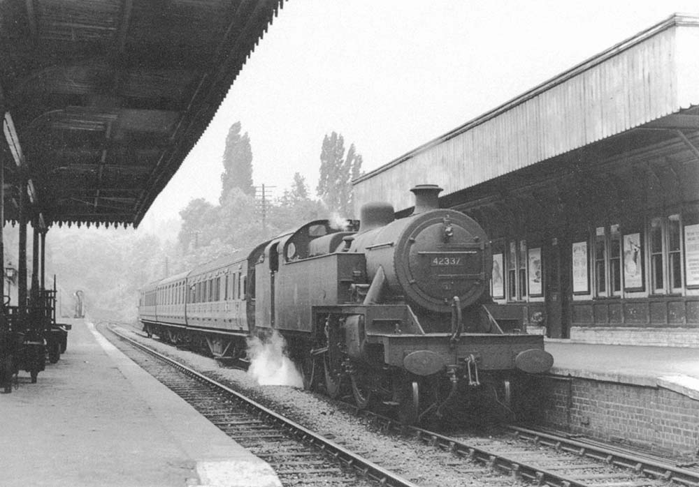 Ex-LMS 4P 2-6-4T No 42337 stands at the up platform with a three coach local passenger service to New Street on 19th June 1955