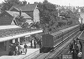 View of the station looking south as a train with a rake of close coupled stock, leaves the station for Evesham