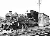Ex-LMS Fowler 2-6-4T No 42334 and an unidentified ex-MR 3F 0-6-0 goods engine stand outside the single road engine shed