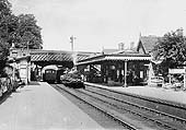 Looking north towards Barnt Green as two goods trains pass each beneath Bromsgrove Road bridge