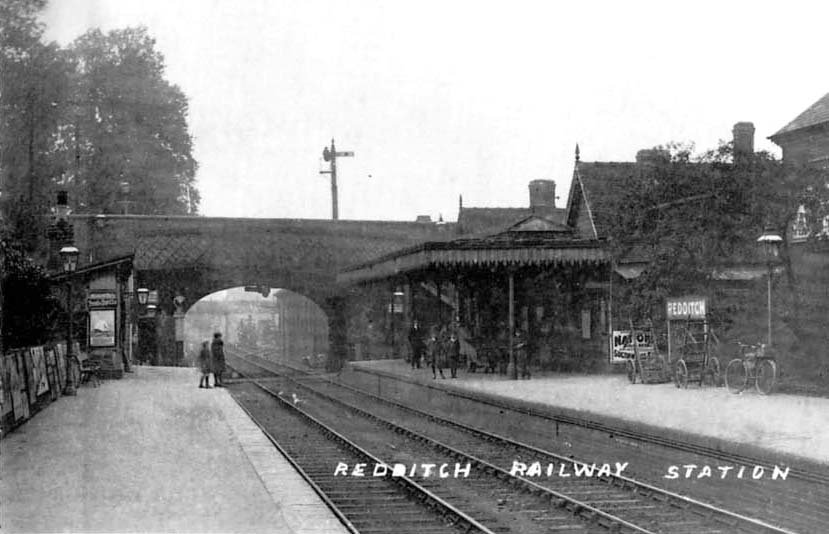 Looking towards Birmingham with a goods locomotive standing in the distance in the goods yard
