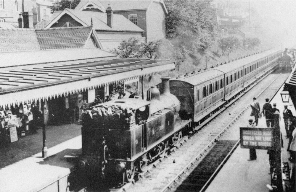 A Johnson goods engine on an Evesham to New Street service approaches Johnson 0-4-4T No 1259