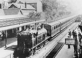A Johnson goods engine on an Evesham to New Street service approaches Johnson 0-4-4T No 1259