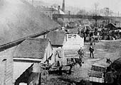 Scene showing the loading of horse drawn vehicles at the MR built goods shed located in Redditch's first goods yard